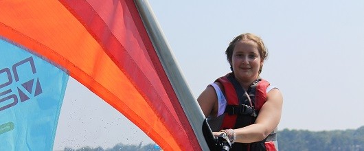 Girl windsurfing windsurfing