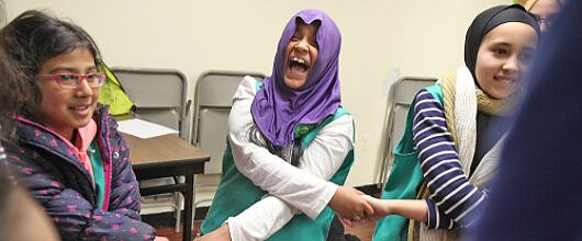 Three Girl Scouts laughing and holding hands Three Girl Scouts laughing and holding hands