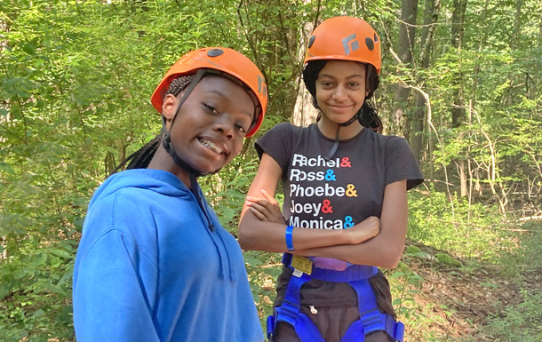 two campers prepping for a ropes challenge course