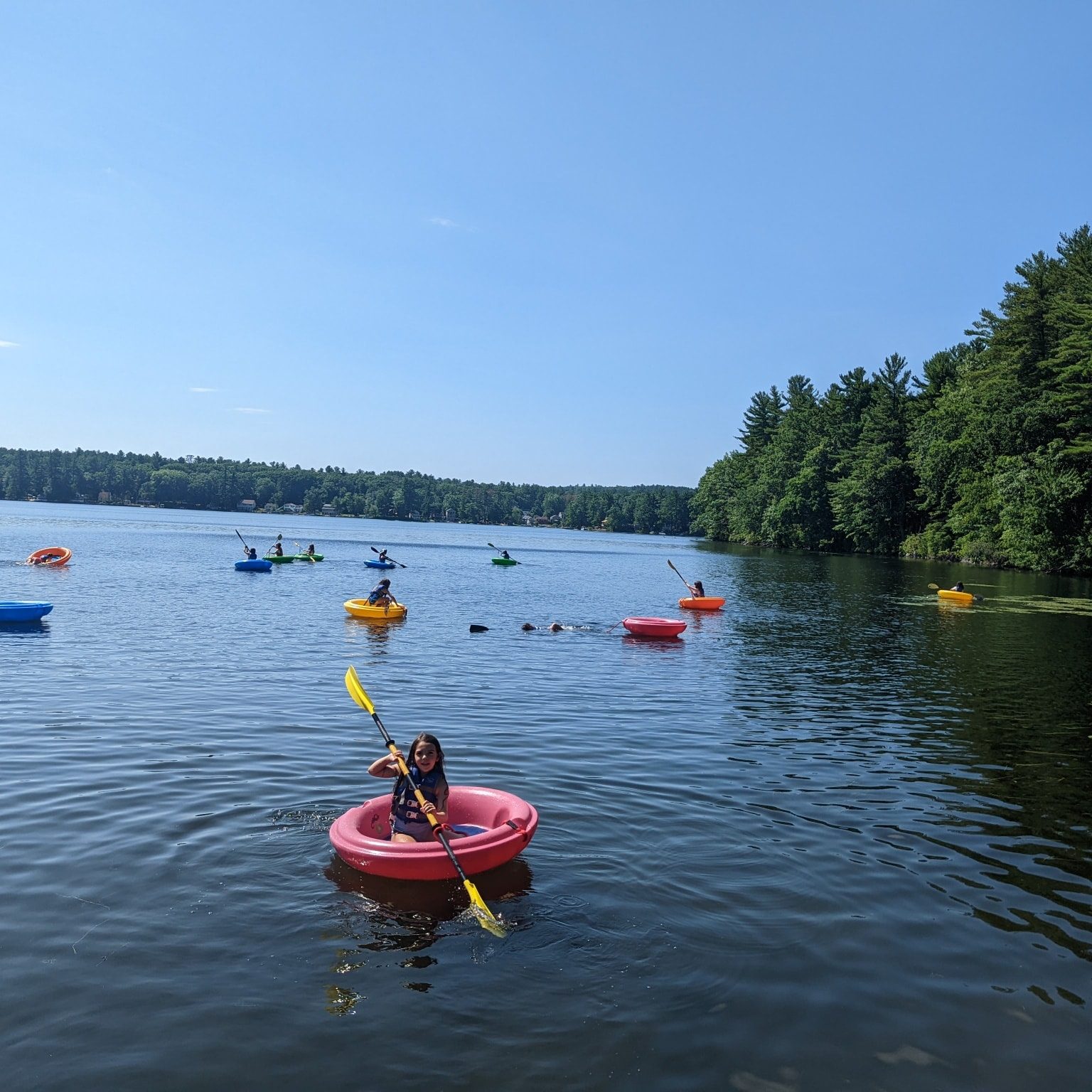 girl boating on the pond