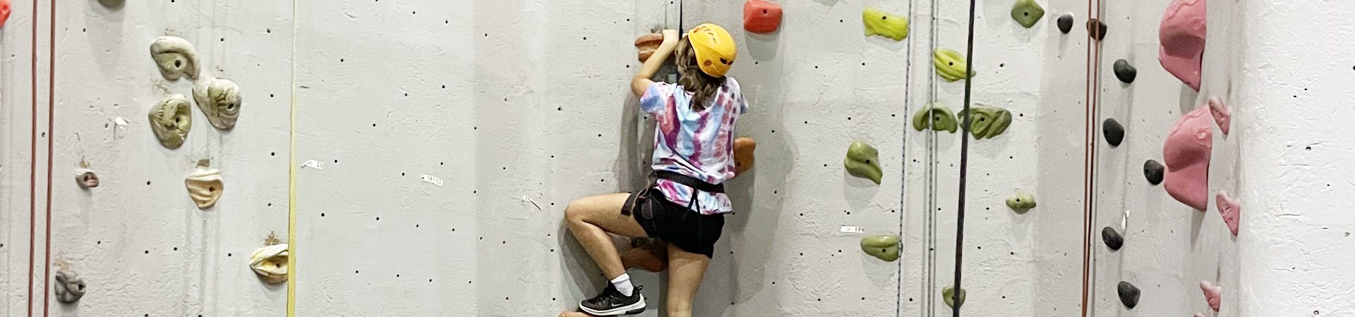  girl indoor rock climbing 