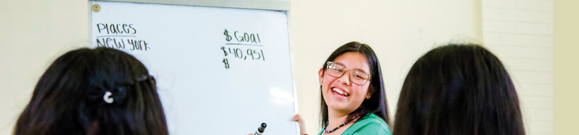  girls with white board  