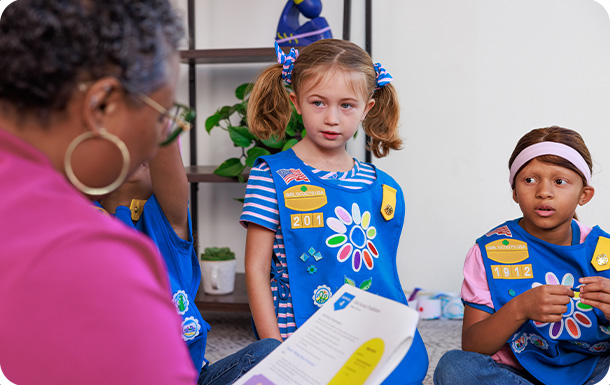 picture of troop leader with daisy girl scouts